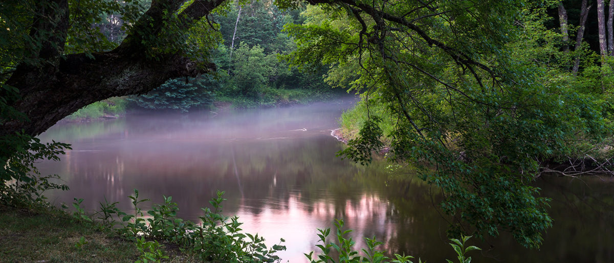 Camp Beside the Manistique River at Northland Outfitters