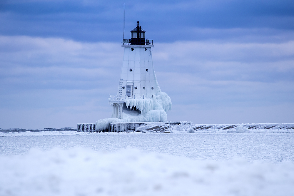 A frozen Ludington Breakwater Tower at Blue Hour