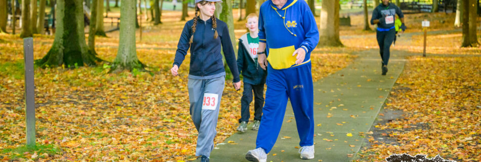 Amie & and her dad at the finish of Dragons in the Woods 5K
