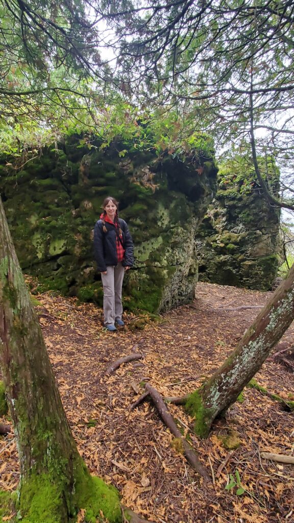 Amie by a boulder