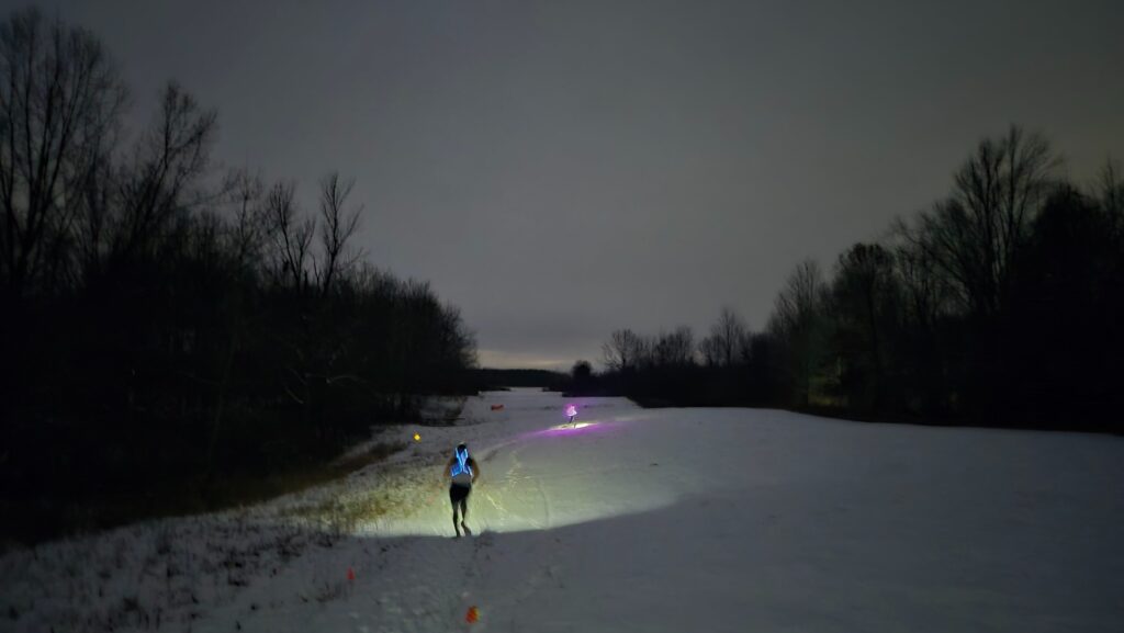 An open field with runners at the Full Moon 5