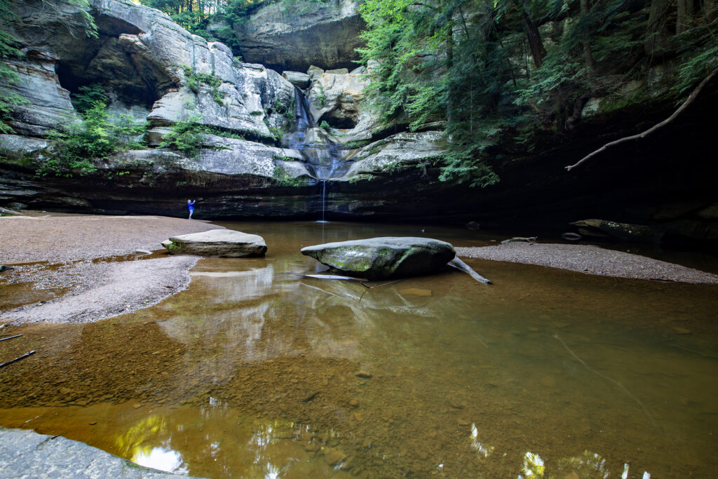 Cedar Falls trickling down the cliff into a plunge pool below