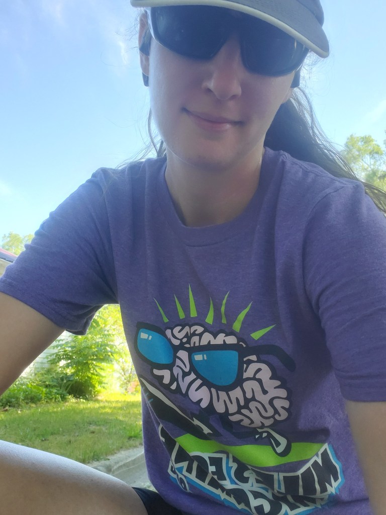 Amie wearing Miles for Migraine shirt
