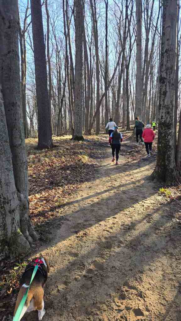 Dakota on the Spring Trail Trot course, following other runners