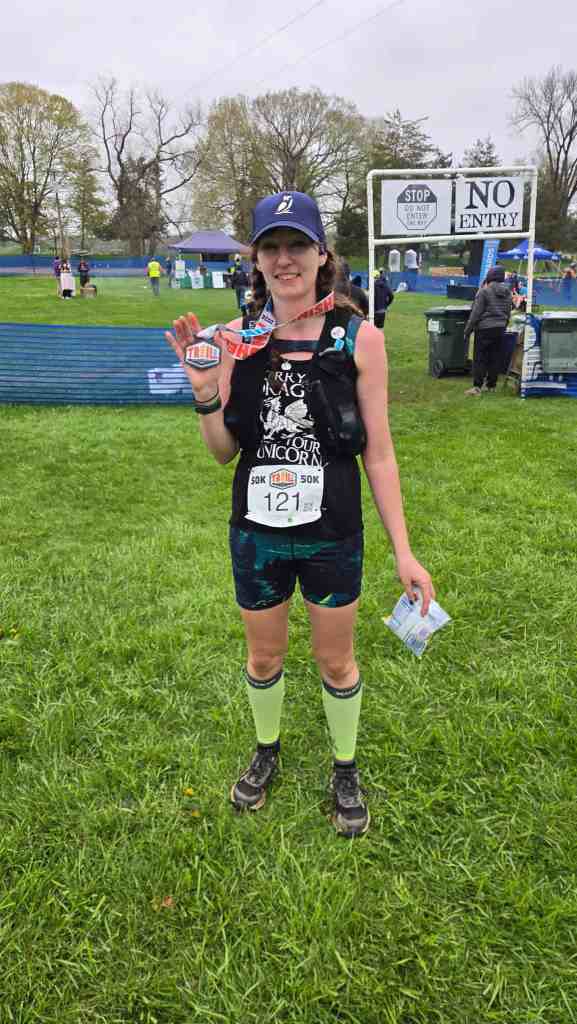 Amie at the finish line for Trail Week 50K