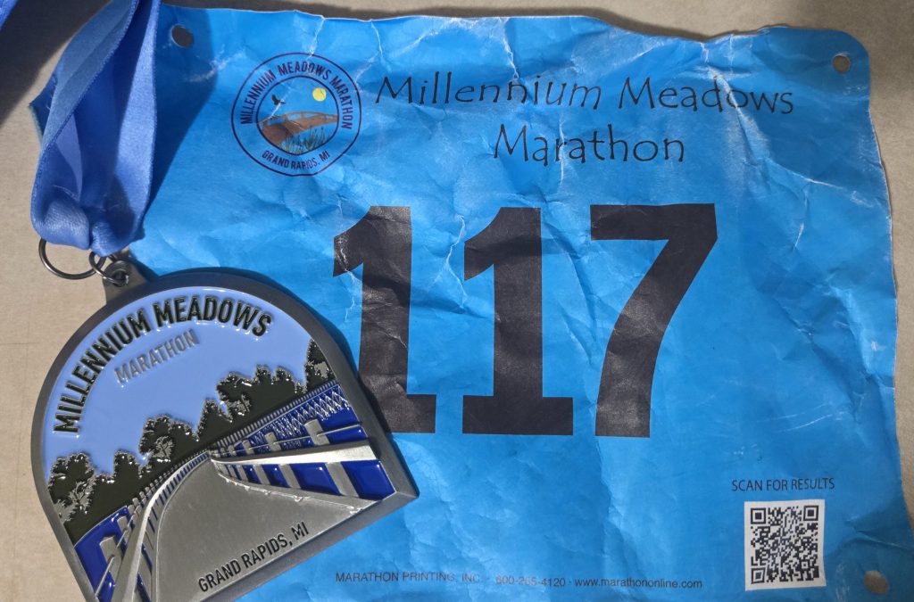 Amie's bib and finisher medal